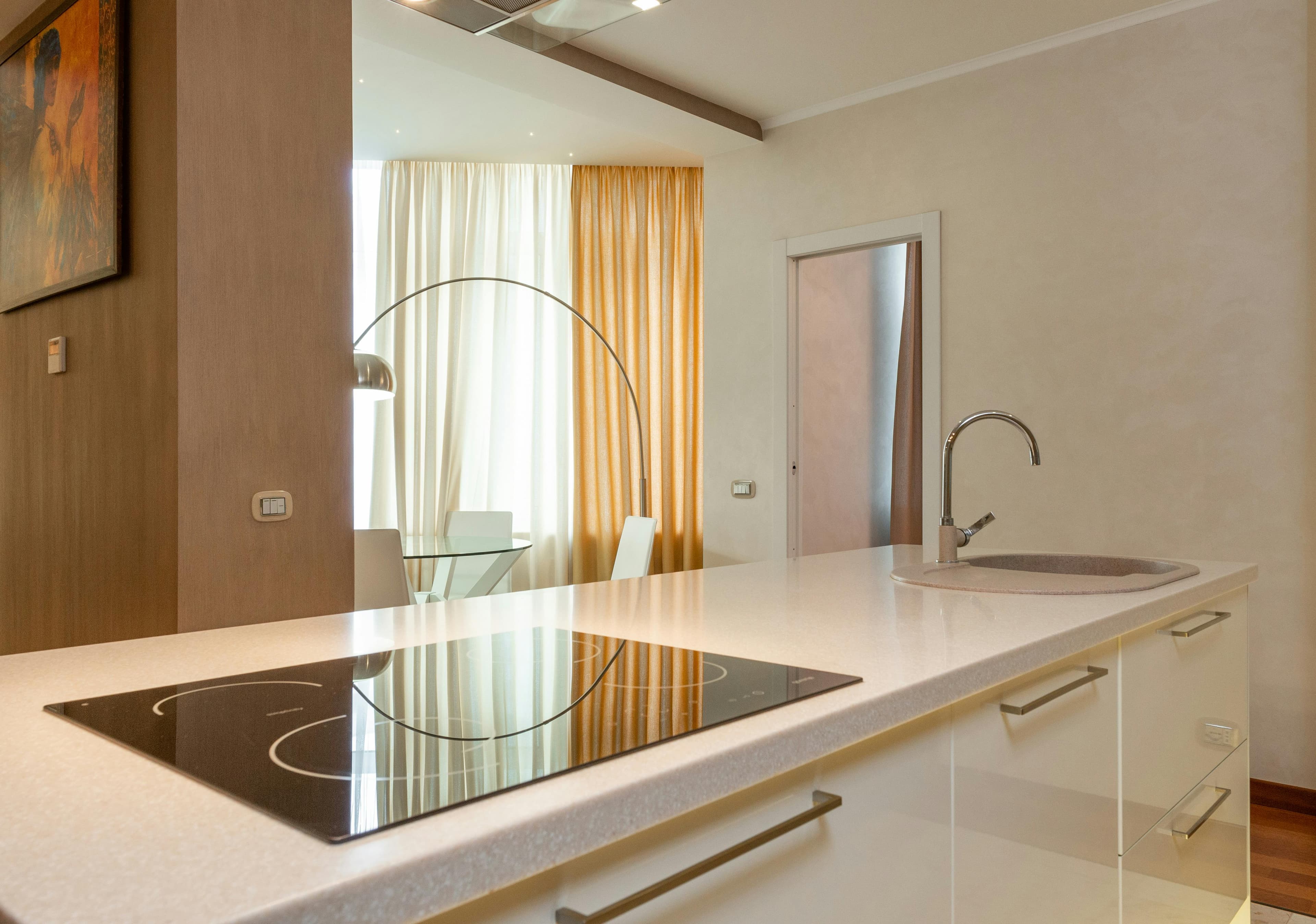 White cream countertop in a warm bright kitchen